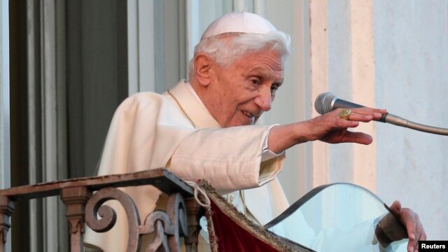 Pope Benedict XVI waves as he appears for the last time at the balcony of his summer residence in Castel Gandolfo