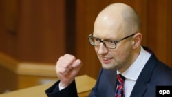 Ukrainian Prime Minister Arseniy Yatsenyuk addresses parliament ahead of a no-confidence vote in his leadership on February 16.