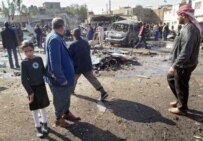 The scene of a dual car bombing in Baghdad today (AFP)