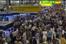 U.K. --  People queue at London's Heathrow airport, 10Aug2006