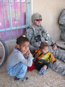 Iraq -- kids with U.S. soldiers (around Forward Operating Base Normandy, Iraq)