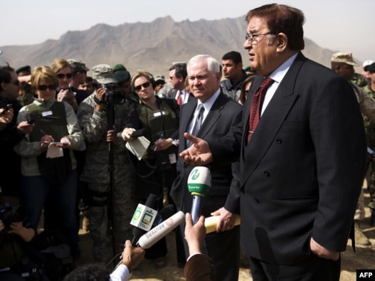 U.S. Defense Secretary Robert Gates and Afghan Defense Minister Abdul Rahim Wardak (right) talk to reporters in Kabul in March. Are Western media seeing the problems of Afghanistan through a lens of self-interest?