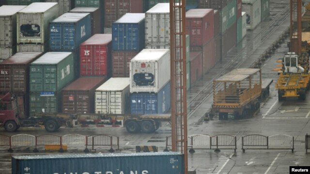 Shipping containers ready and waiting at the Shanghai port.