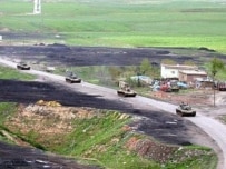 Turkish armor moving near the Iraq border on May 31 (AFP)