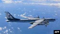 A Russian TU-95 flies in airspace near the isle of Okinoshima in western Japan in August 2013.