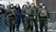 Separatist leader Aleksandr Zakharchenko (center) walks with bodyguards in the center of Donetsk on January 22.