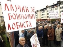 A Bosnian Serb holds a banner saying \