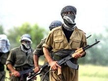 Iraq -- A PKK (Kurdistan Workers Party) fighter jog during a training session, at the Amedia area in Northern Iraq, 10 km near the Turkish border, 20Jun2007