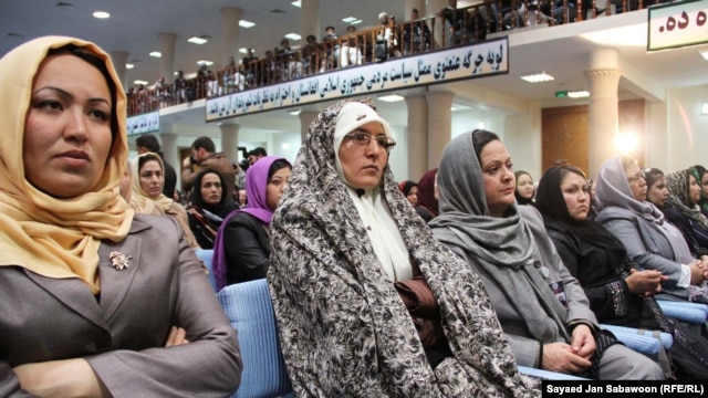 Delegates listen to Afghan President Hamid Karzai speak during the first day of the Loya Jirga on November 16.