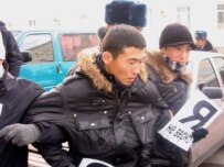 'I Don't Believe' protesters are detained in Bishkek on December 18