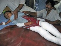Child injured in car bombing lies in Peshawar hospital (RFE/RL)