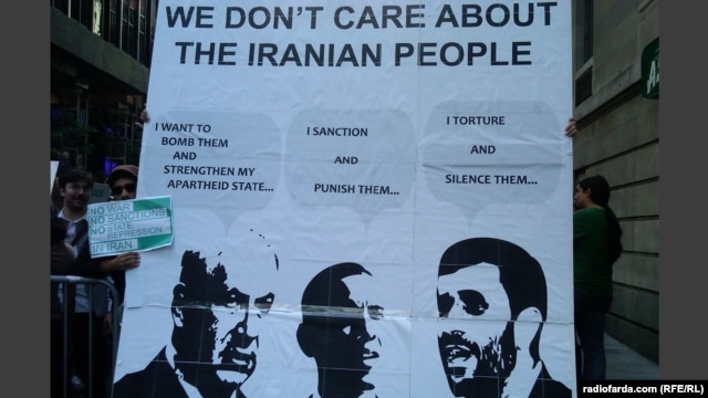 Demonstrators in New York hold up a sign criticizing the Israeli, U.S., and Iranian leaders.