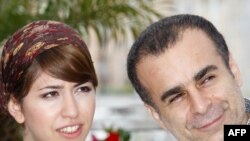 Iranian director Bahman Ghobadi (right) and actress Negar Shaghaghi enjoy themselves at the Cannes Film Festival in May.