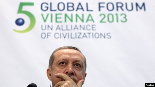 Turkish Prime Minister Tayyip Erdogan listens during a news conference after the opening session of the fifth United Nations Alliance of Civilizations (UNAOC) Forum in Vienna on February 27.