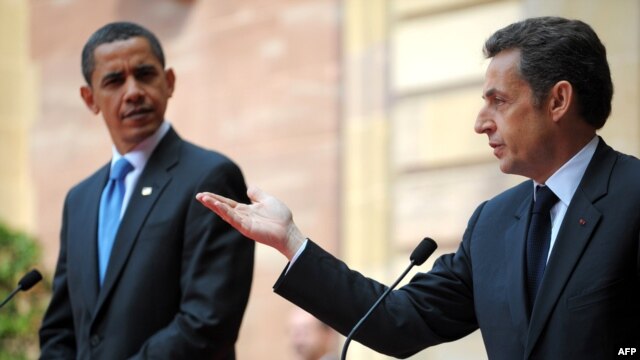 French President Nicolas Sarkozy (left) told his U.S. counterpart, Barack Obama, that France is "not waging war against Afghanistan."