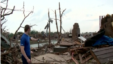 Survivor Ricky Stover surveys damage from the May 20 tornado in Moore, Oklahoma.