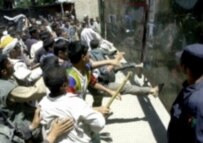 Arrests after the escape by the four suspected terrorists led to protests outside Bagram on 26 July (AFP)