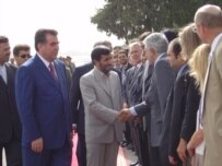 Presidents Rakhmonov (left) and Ahmadinejad (center) in Dushanbe on July 25 (RFE/RL)