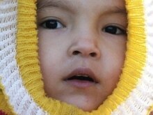 Turkmenistan -- child wrapped for cold in Ashgabat,13feb2007