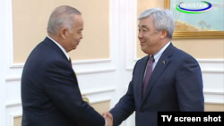 Uzbek President Islam Karimov's (left) meeting with visiting Kazakh Foreign Minister Yerlan Idrisov in Tashkent was shown on state television.