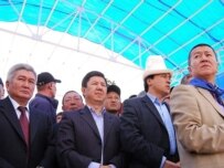 Kulov (left) with other opposition leaders at a rally in April (ITAR-TASS)