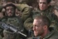Israeli soldiers rest after a battle on the Lebanese border (epa)