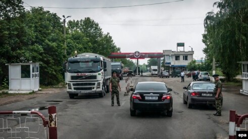 Russian soldiers manning a border station near Benderi, in Moldova's breakaway Transdniester, in June 2013