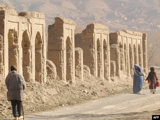Afghans walk in the old city of Bamiyan, on an old Silk Road trade route.