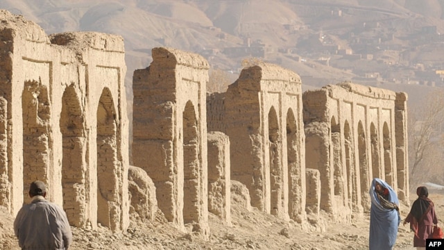 Afghans walk in the old city of Bamiyan, on an old Silk Road trade route.