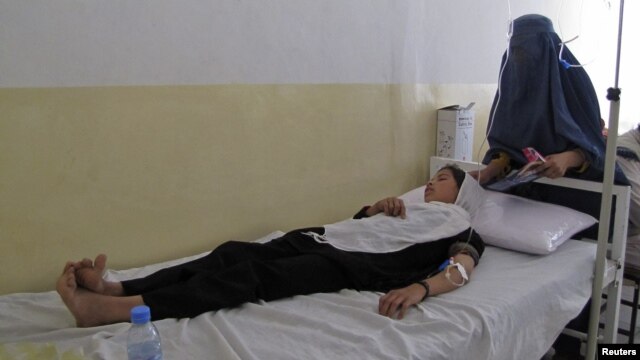 A schoolgirl receives treatment at a hospital after the May 23 poisoning poisoned in the same province.