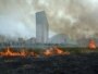 Russia -- Grass lits on fire by severe heat at Khodynskoe pole aviation museum in Moscow, 29Jul2010
