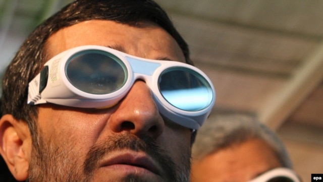 President Mahmud Ahmadinejad visits a technology exhibition. Western governments fear that his regime is developing nuclear weapons.