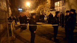Armenia - Police officers at the scene of an armed attack on opposition presidential candidate Paruyr Hayrikian in Yerevan, 1Feb2013.