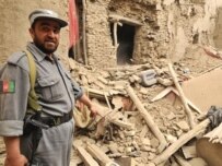 An Afghan police officer stands outside the house in Kabul where security forces clashed with suspected Taliban militants (AFP)