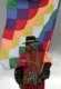 A native Bolivian holds a flag symbolizing the old Inca empire at an Indian ceremony to induct Evo Morales as Bolivia's president in January (AFP)