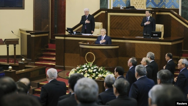 President Nursultan Nazarbaev and members of the government and parliamentarians listen to the Kazakh national anthem before the opening of the first session of the newly elected parliament in Astana in January 2012.