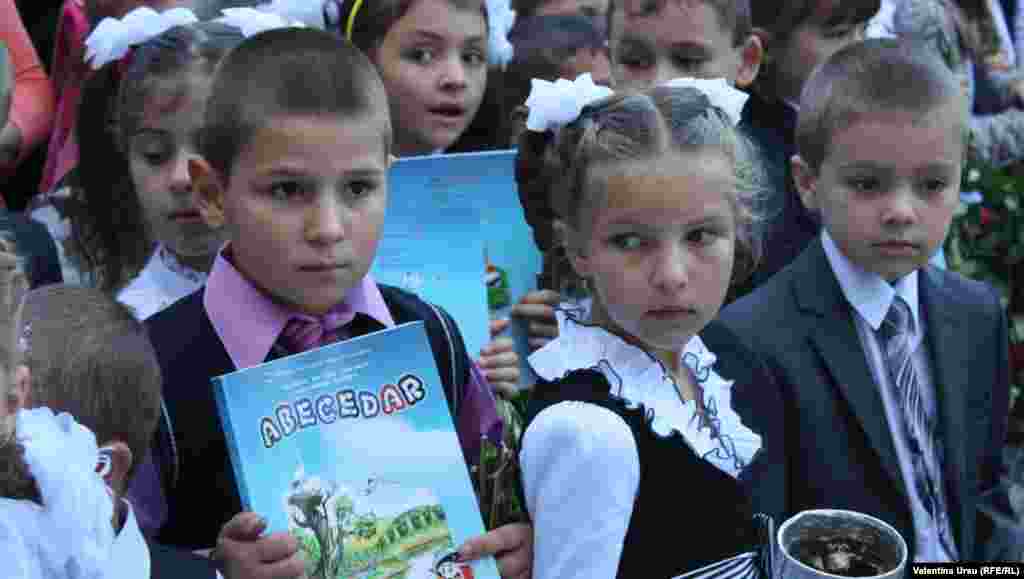 Equipped with textbooks, kids in Balanesti, Moldova, are ready to learn.