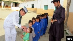 Children are vaccinated against polio during a three-day nationwide campaign to eradicate the disease, in Landikotal, near the Pakistani-Afghan border last month.