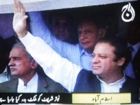 Former Prime Minister Nawaz Sharif waves as he steps off his plane today at Islamabad airport, shortly before he was deported (AFP)