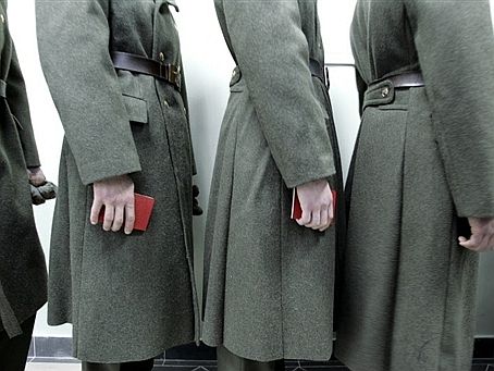 Russia -- Soldiers holding their identification line up at a polling station in the town Balashikha, 02Dec2007