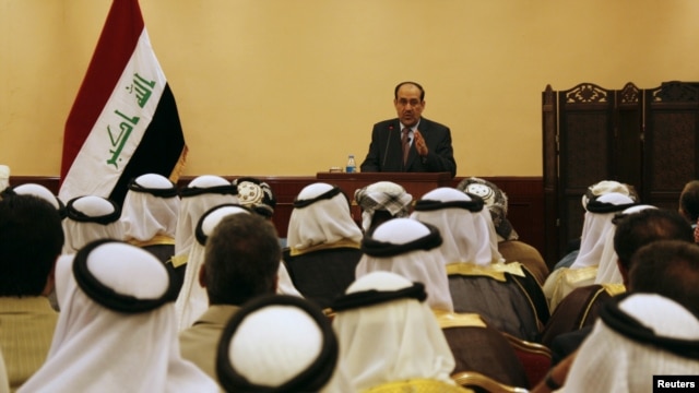 Iraqi Prime Minister Nuri al-Maliki speaks during a meeting with tribal leaders in Mosul in late May.