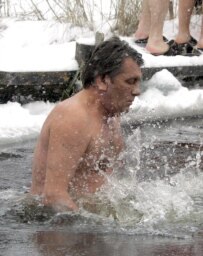 Ukrainian President Viktor Yushchenko takes a dip in the icy-cold waters of the Dnieper River, 19 January (epa)