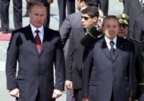Putin (left) being greeted by Algerian President Abdelaziz Bouteflika on March 10 (epa)