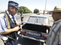 Police check cars for weapons on the road to Ekazhevo, Ingushetia (AFP)