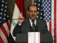 Al-Maliki speaking at the November 30 press conference in Amman (epa)
