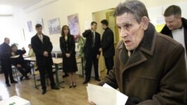 Voters go to the polls in Russia's 2004 presidential election, in which then-outgoing President Vladimir Putin handed over the reins to Dmitry Medvedev.