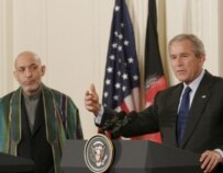 Karzai (left) listens as Bush answers questions at the White House on September 26 (epa)