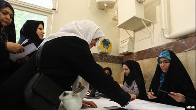 Women in Tehran cast ballots in the country's runoff election for parliament.  

