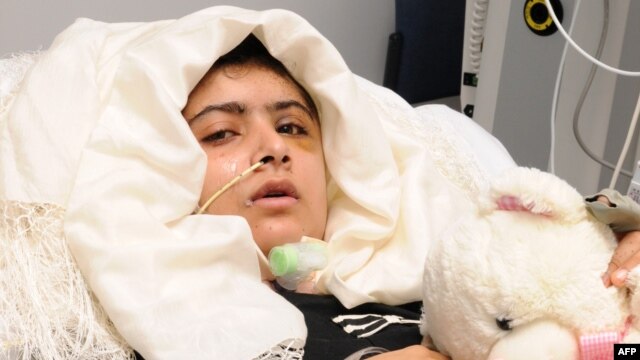 This handout picture received from the Queen Elizabeth Hospital/University Hospitals in Birmingham on October 19 shows Malala Yousafzai lying in her bed after receiving treatment at the hospital.