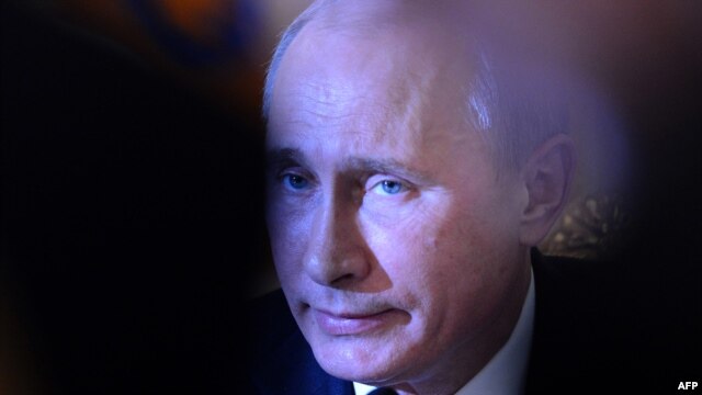 Russian President Vladimir Putin takes part in a meeting of leaders of ex-Soviet nations in the Kremlin, Moscow,  on December 19, 2012. 